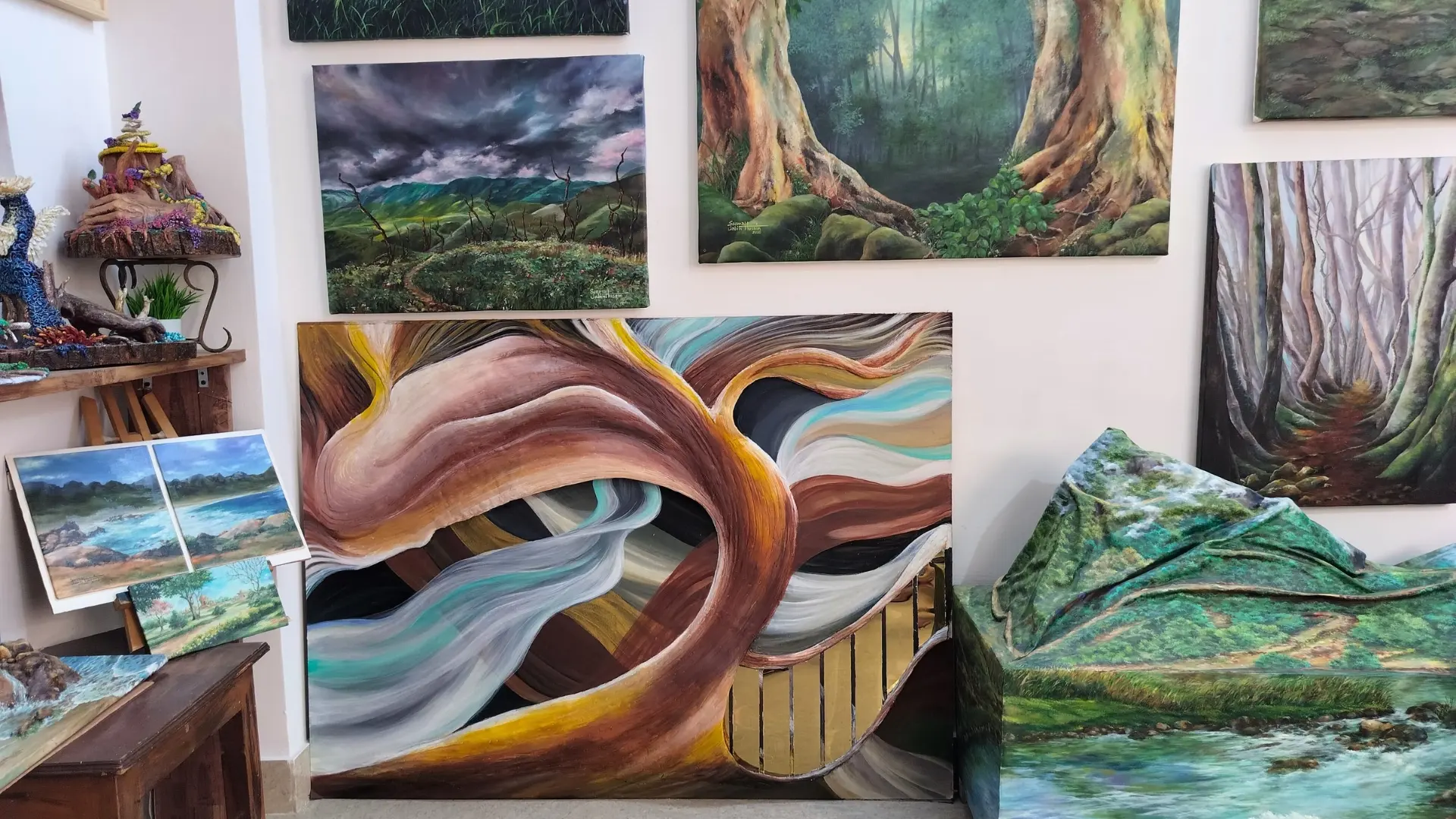 Detail of paintings displayed on the gallery wall