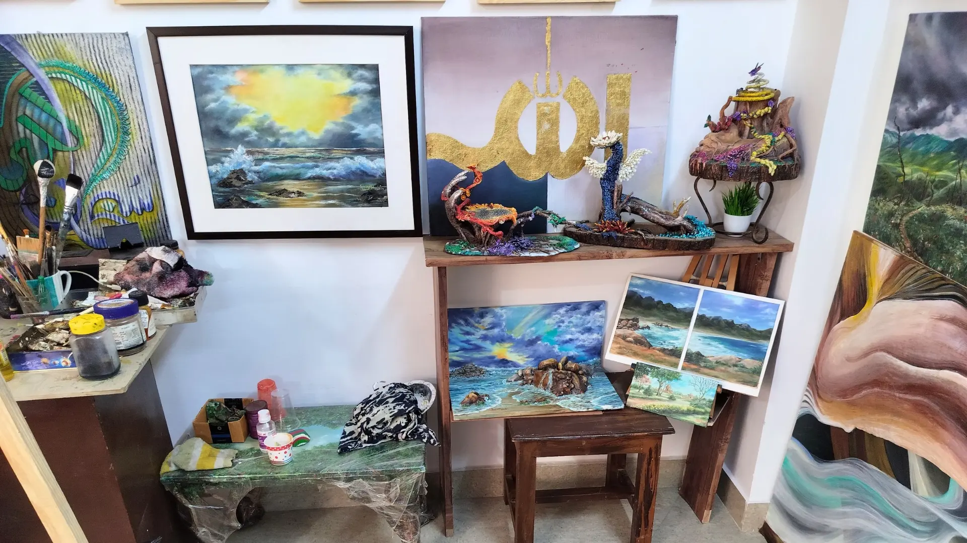 Clay sculptures and mixed-media pieces on display at the studio
